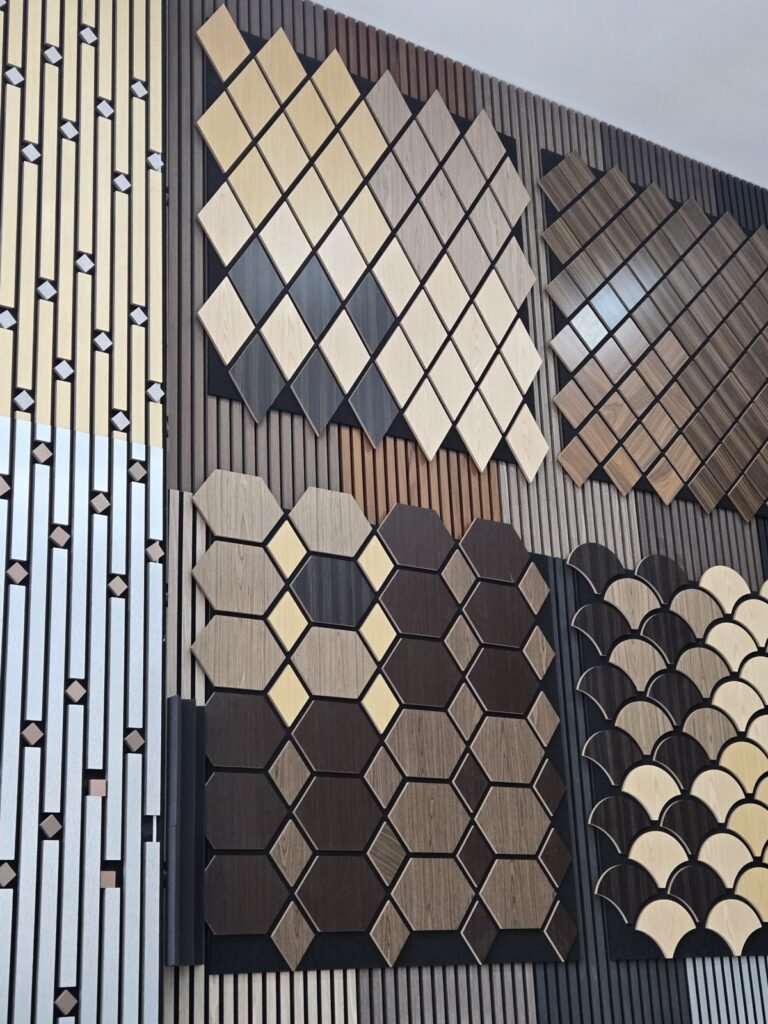 Close-up of acoustic panel designs: diamond, hexagon and fish-scale tiles in mixed timber tones over slatted panels