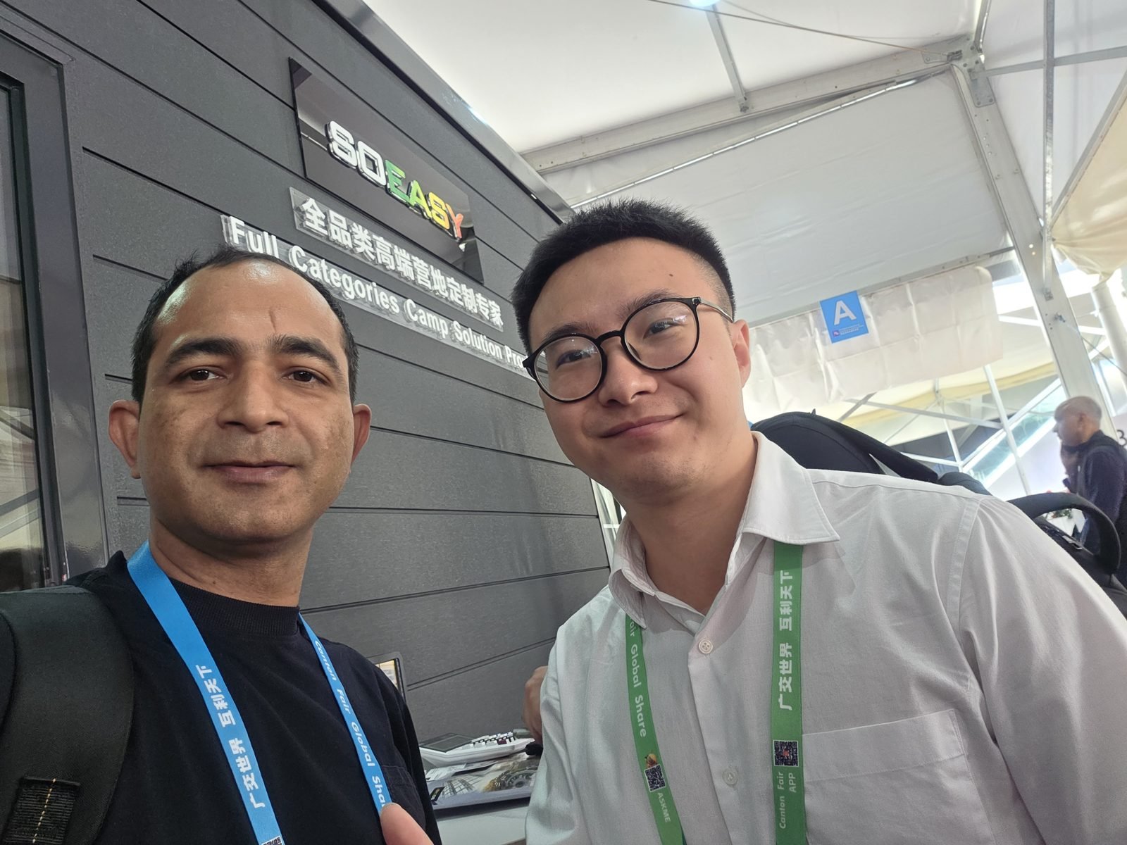 Max with an exhibitor at a camp and cabin solutions booth at the Canton Fair, Guangzhou