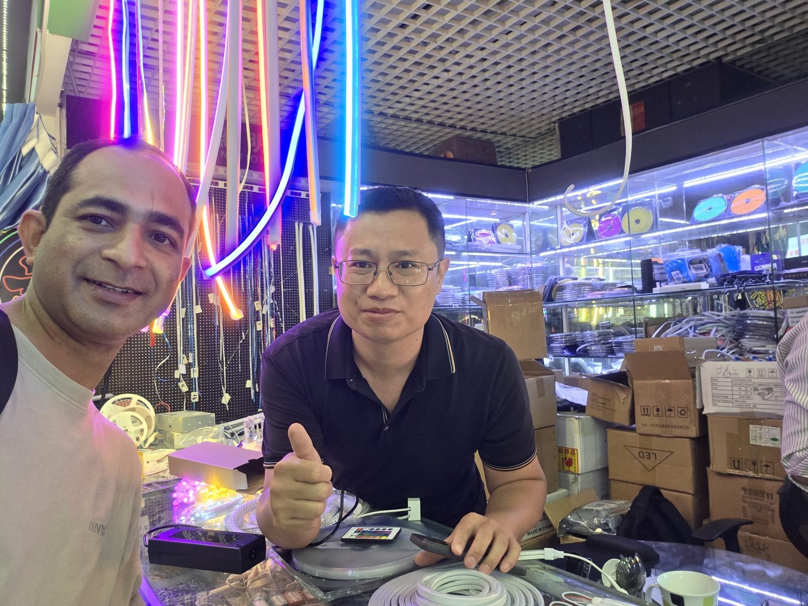 Max with an LED neon strip lighting supplier at his showroom in China